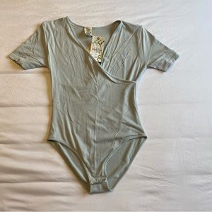 BNWT C’est Moi light blue body suit O/S - small-large